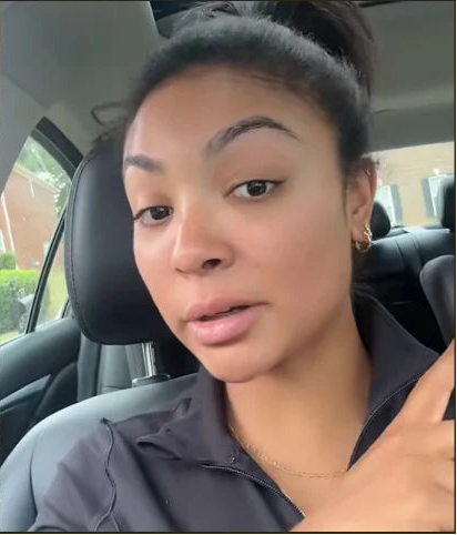 Person with acne on face and another person sitting inside a vehicle.